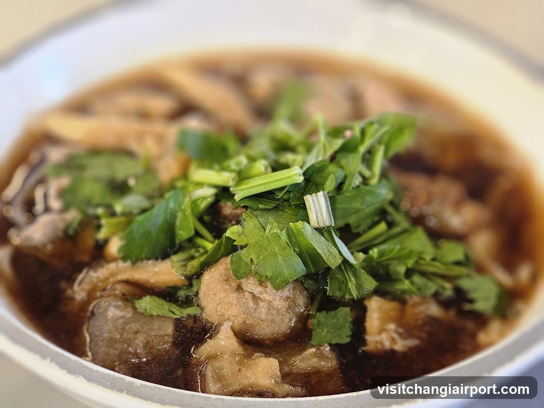 Bowl of Soup with Meatballs and Greens