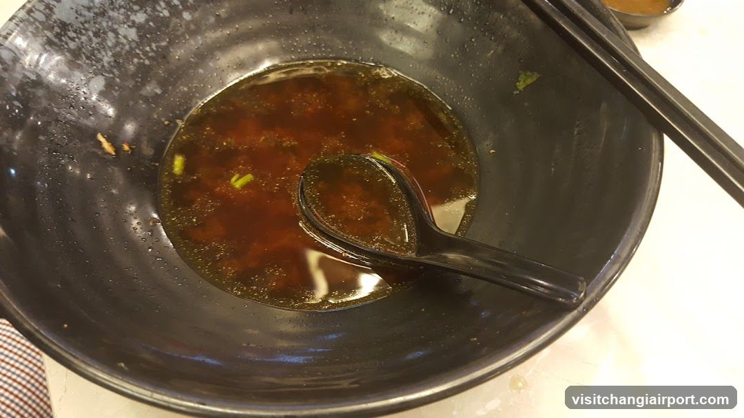 Empty Bowl with Soup and Chopsticks
