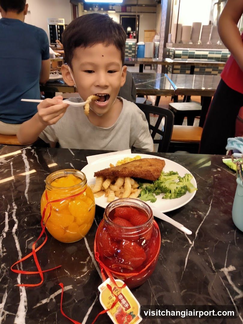 Child Eating Meal with Jars of Preserved Fruit