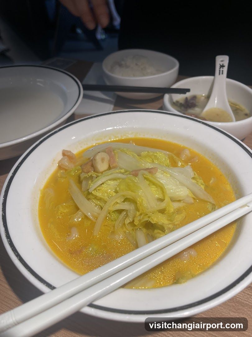 Bowl of Noodle Soup with Cabbage and Shrimp