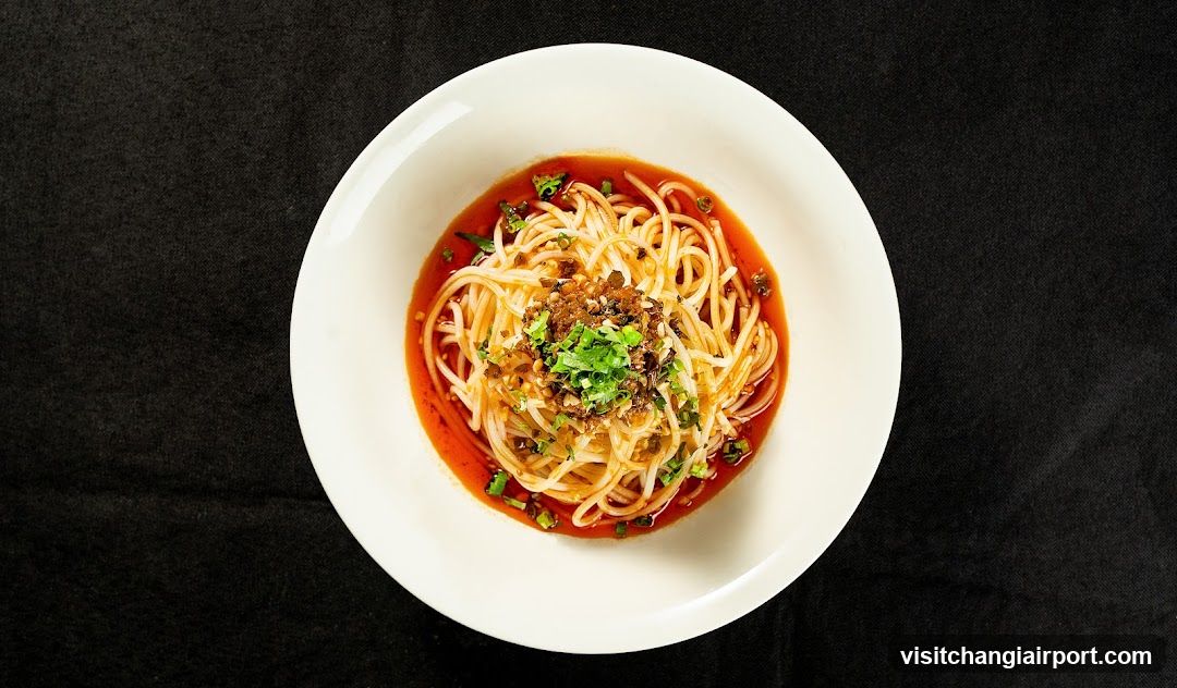 Spicy Noodle Dish in White Bowl