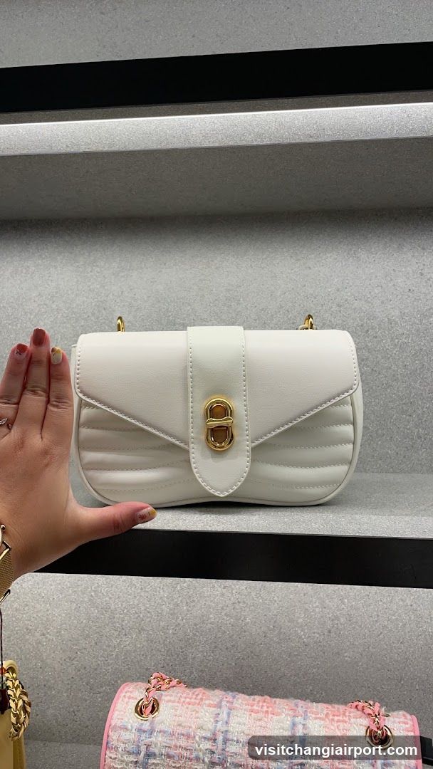 White Quilted Handbag Display