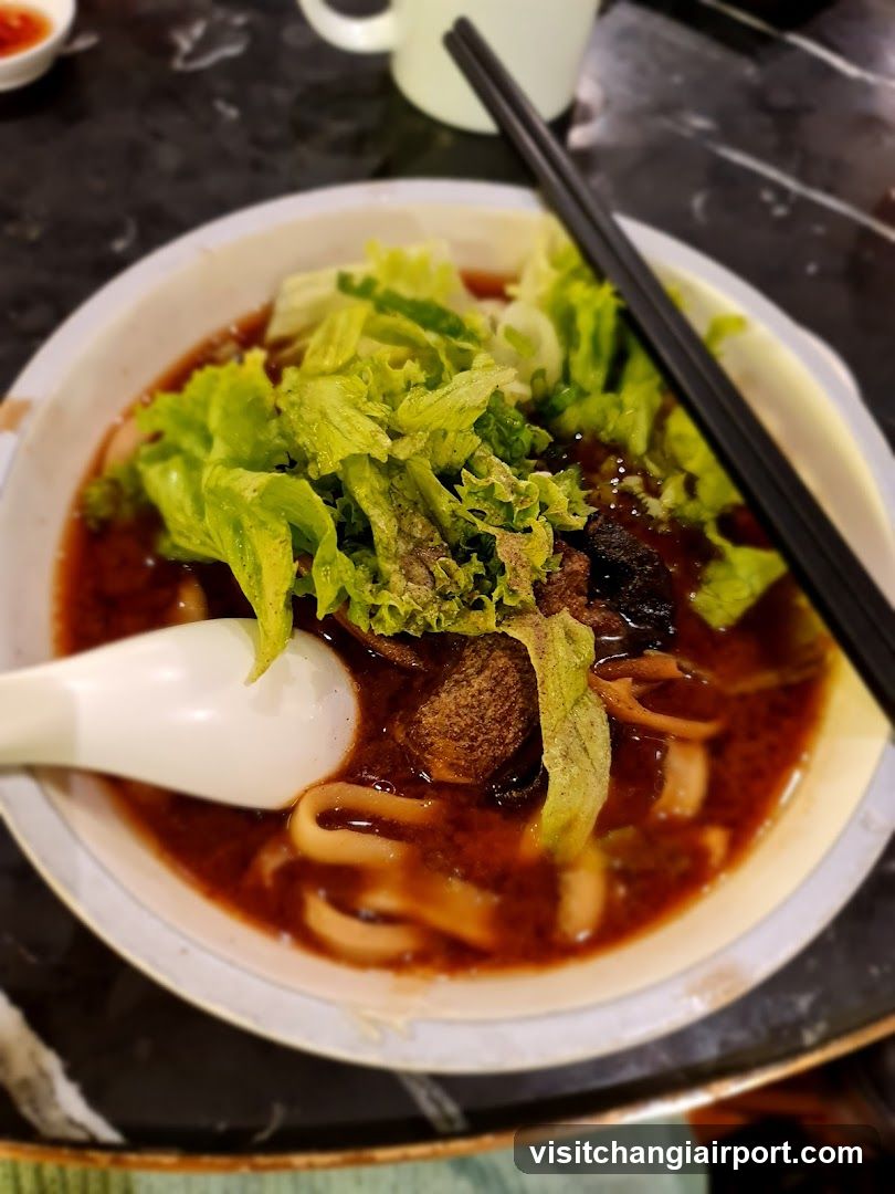 Bowl of Noodle Soup with Lettuce