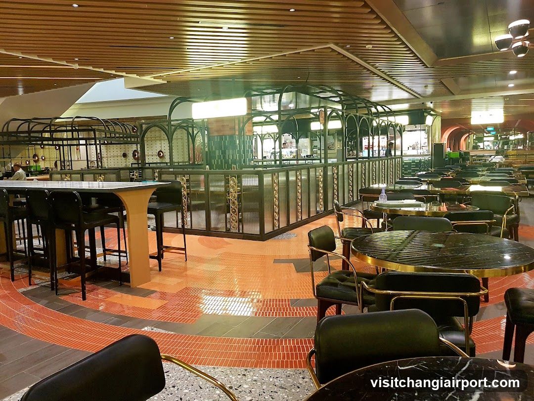 Interior of a modern dining area with bar and tables