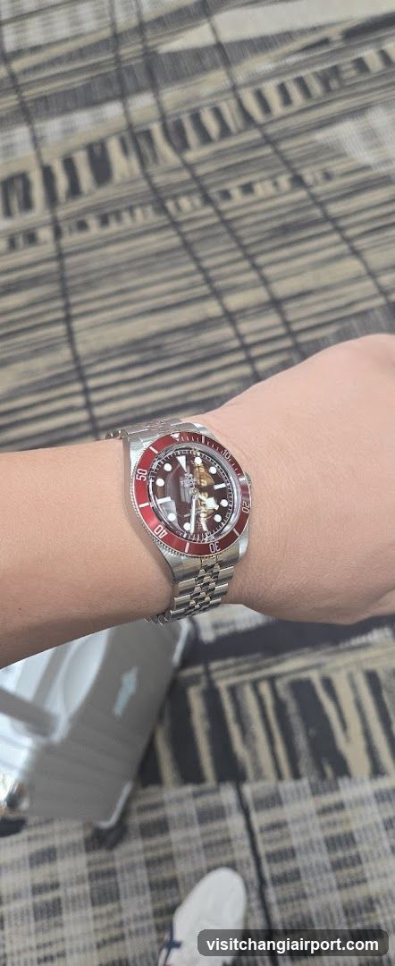 Watch on wrist with patterned background