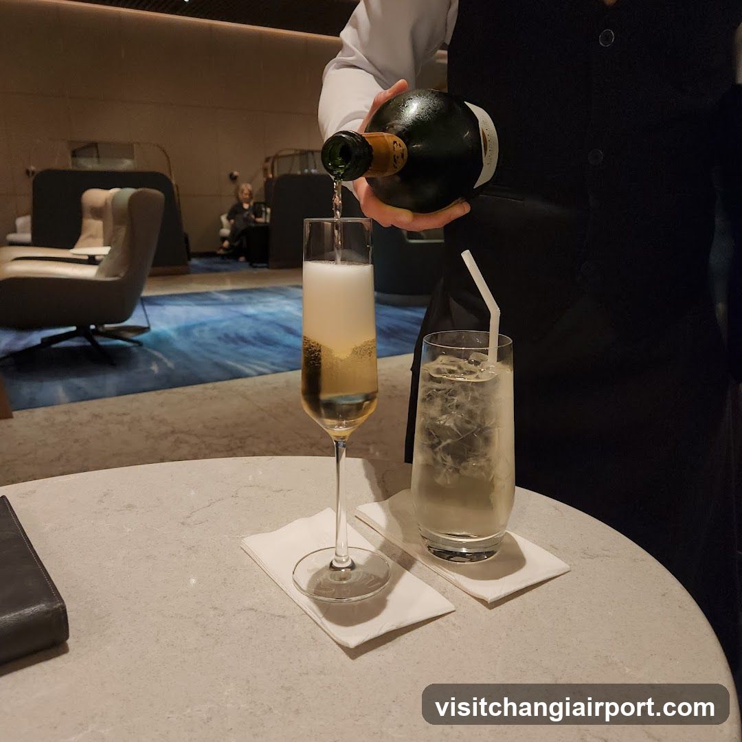 Waiter Pouring Champagne in Lounge