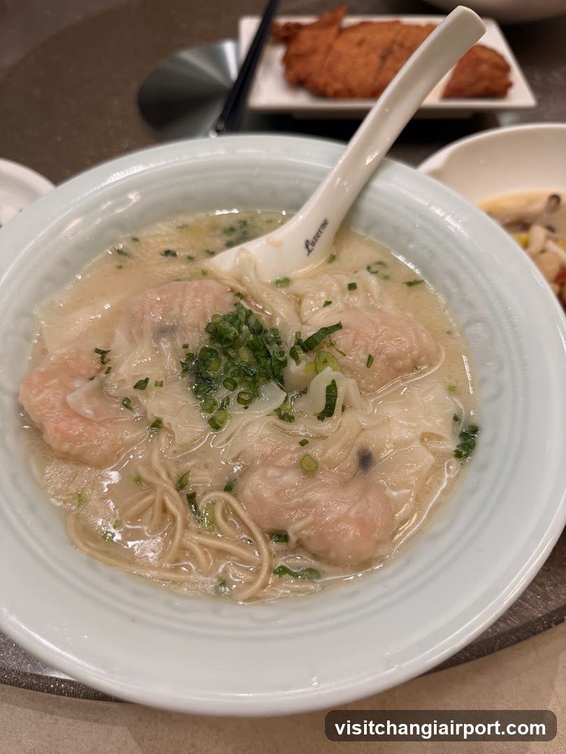 Wonton Noodle Soup with Chopsticks and Spoon