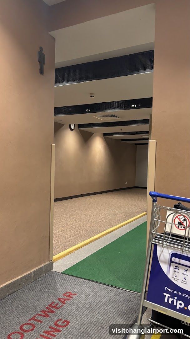Interior hallway with signage and cart