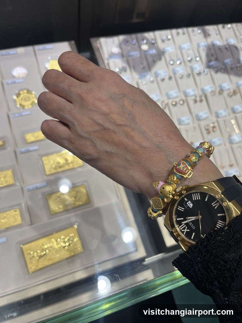 Jewelry Display Case with Gold Watch and Bracelet