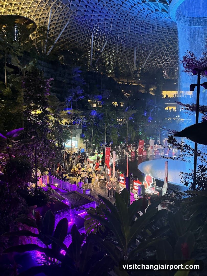 Indoor Night Scene with Waterfall and Crowd