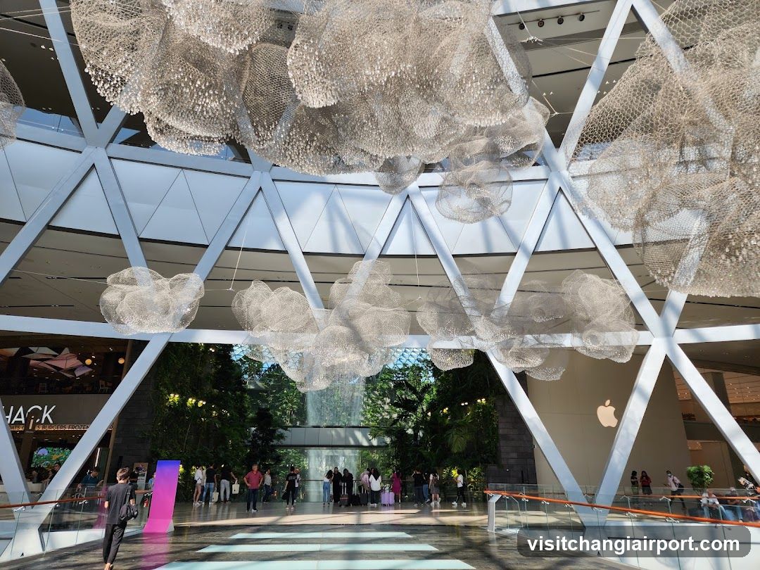Interior of a modern shopping mall with hanging art installations