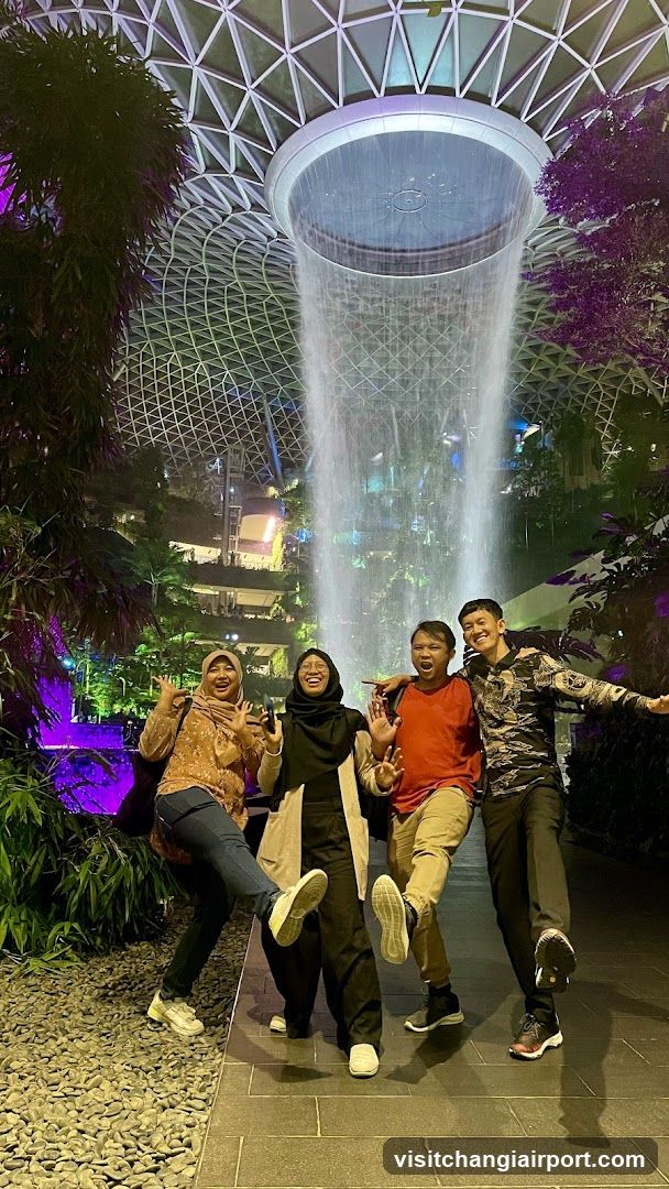 Group photo in indoor waterfall garden
