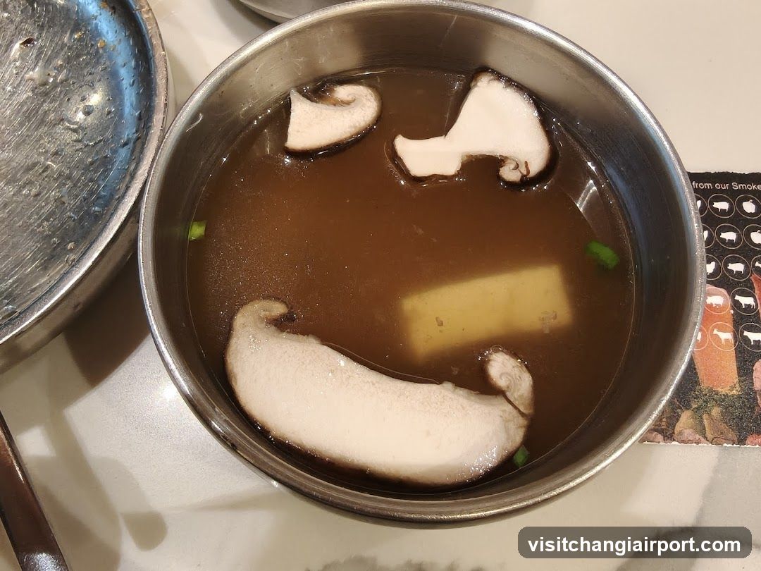 Bowl of Soup with Mushrooms and Tofu