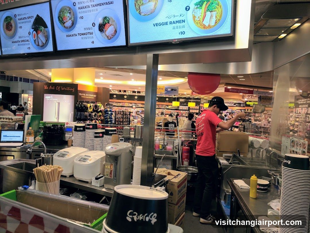 Food stall interior with menu boards above