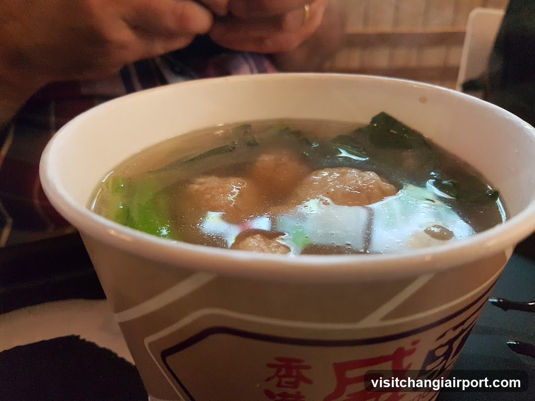 Bowl of Soup with Meatballs and Greens