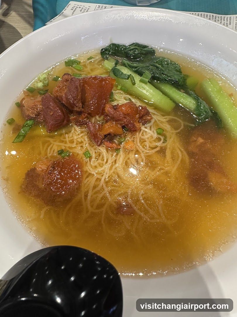 Bowl of Noodle Soup with Meat and Greens