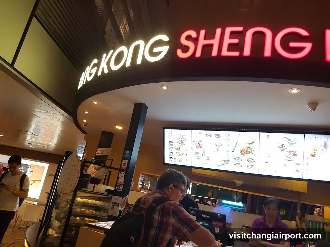 Restaurant Interior with Menu Board and Staff