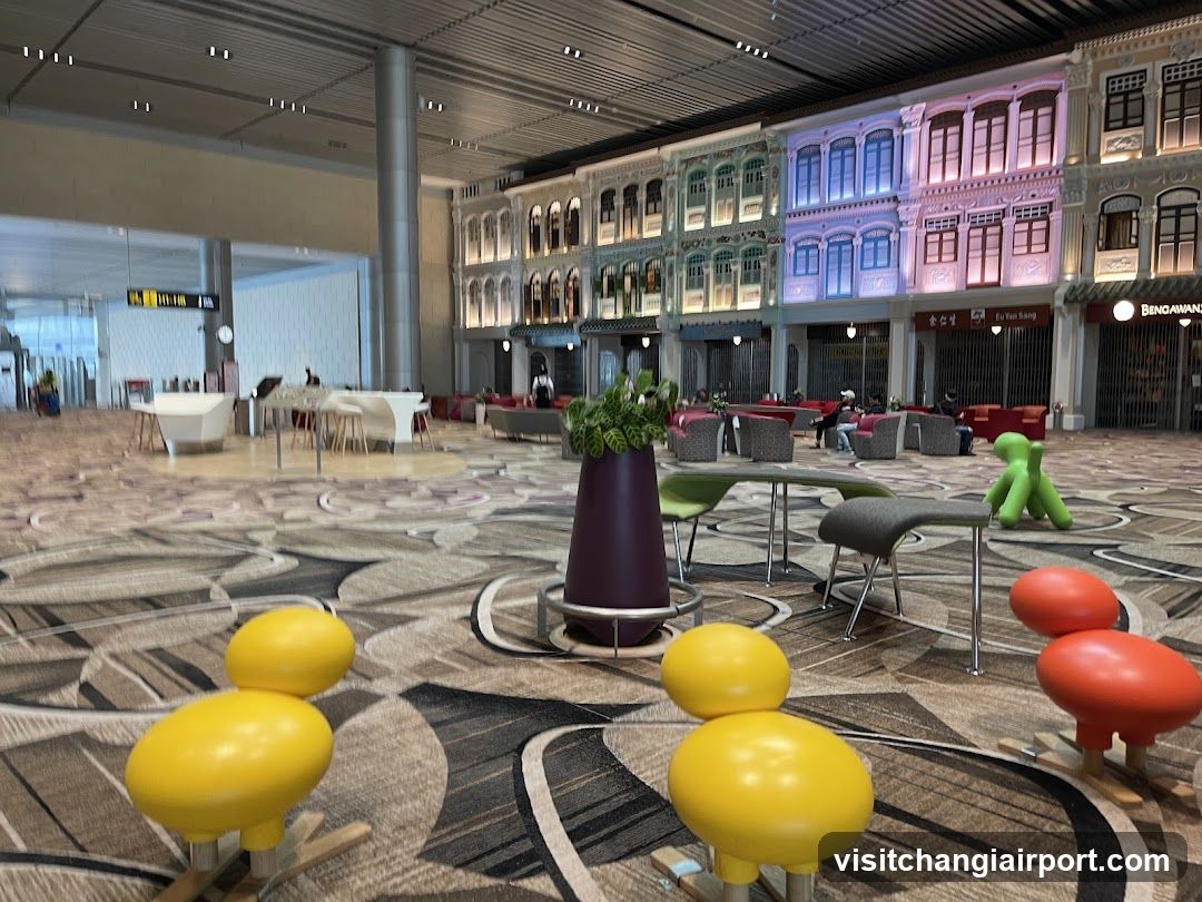Airport Terminal Interior with Decorative Seating and Shop Facades