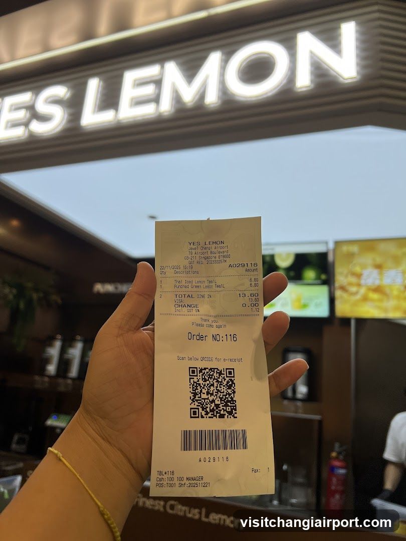 Receipt held in front of Yes Lemon store