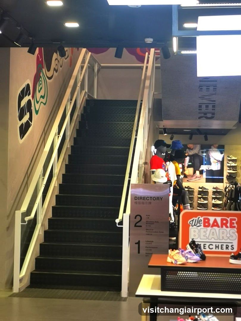 Interior of a shoe store with staircase and merchandise display