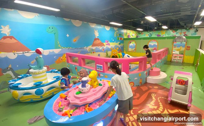 Indoor Play Area with Kids Playing in Sand Pits