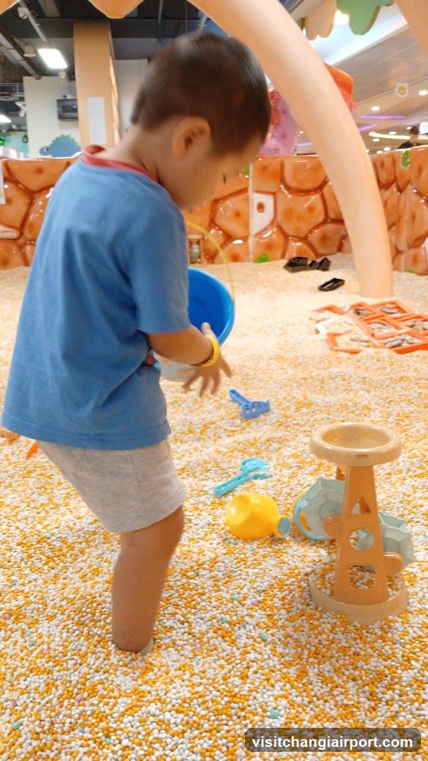 Child Playing in Ball Pit