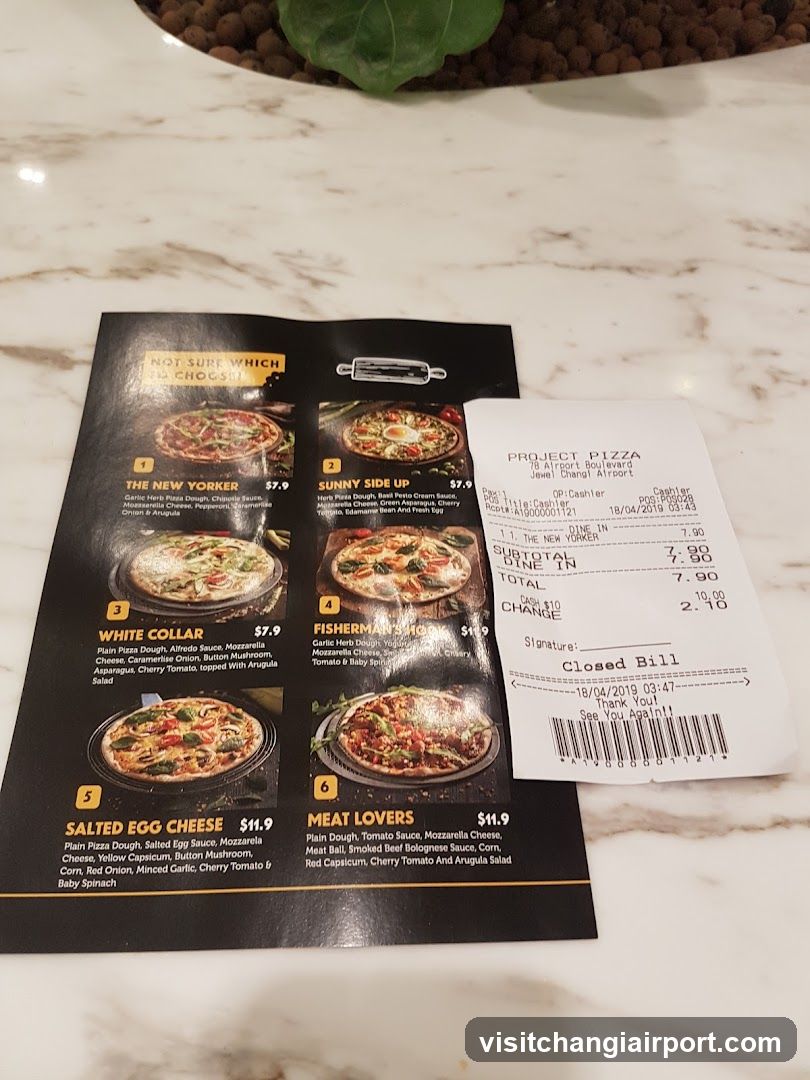 Pizza Menu and Receipt on Marble Table