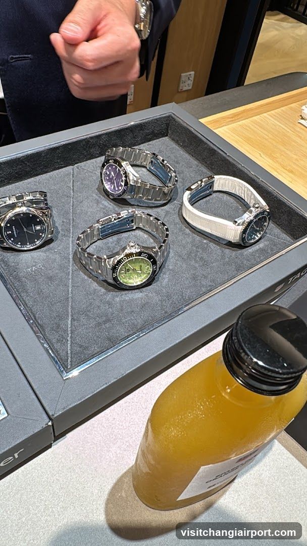 Watch Display Case with Orange Bottle