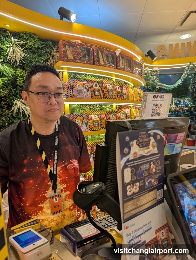Staff at checkout counter with product display