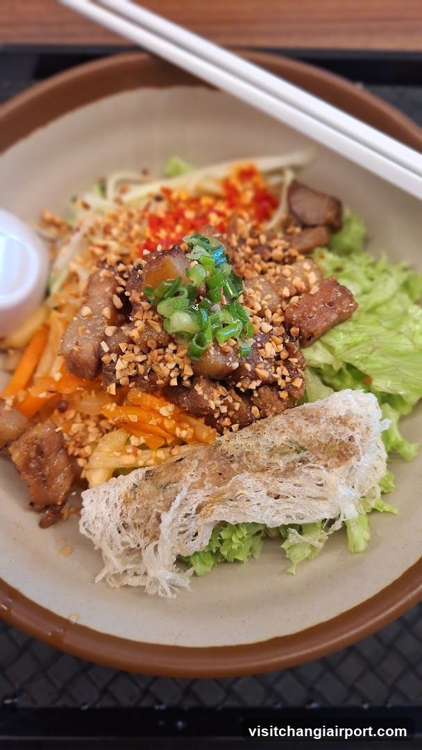 Bowl of Stir-Fried Meat with Noodles and Vegetables