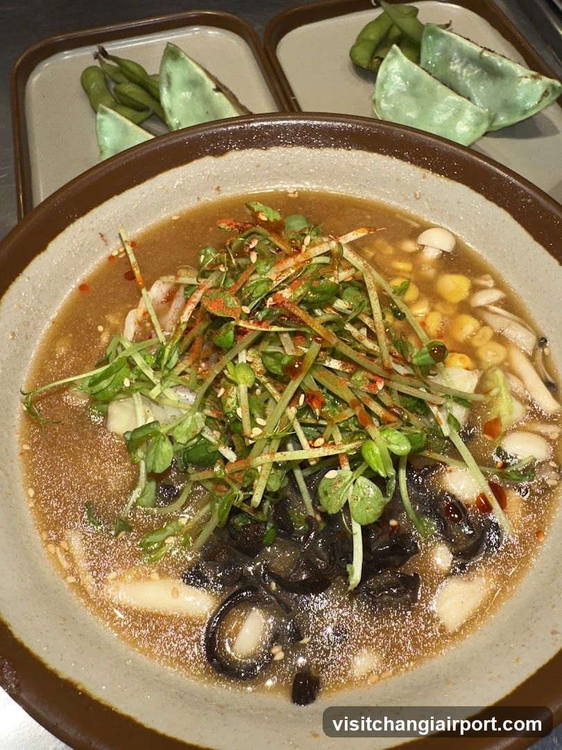 Bowl of Soup with Edamame and Greens