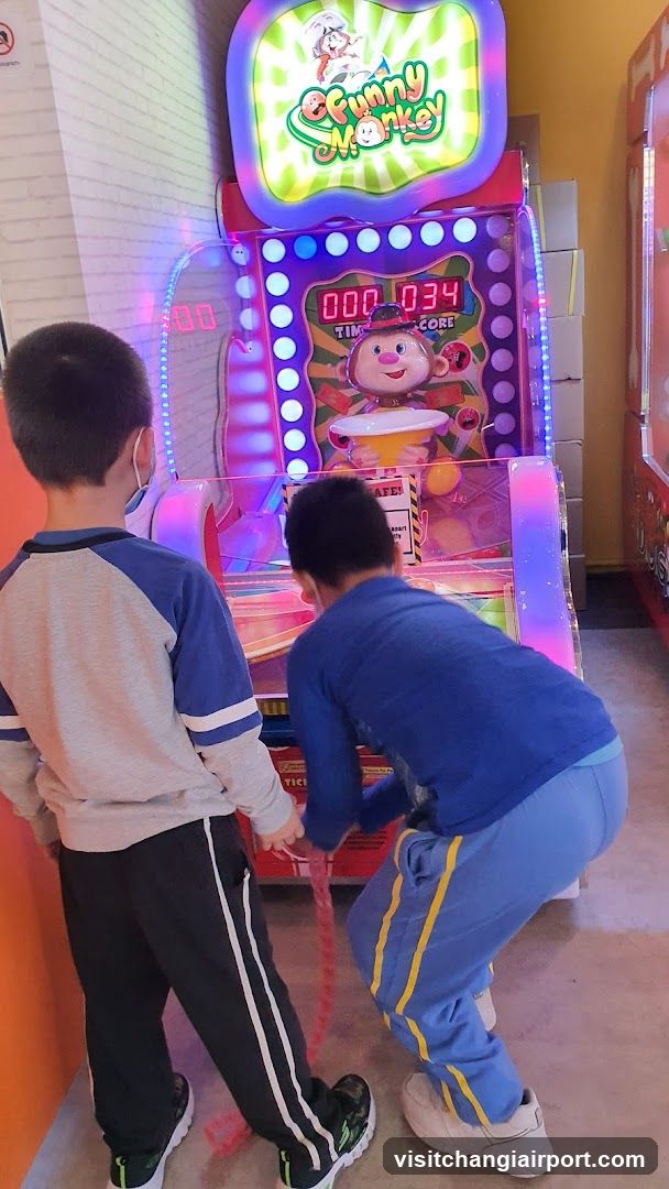Kids Playing Arcade Game