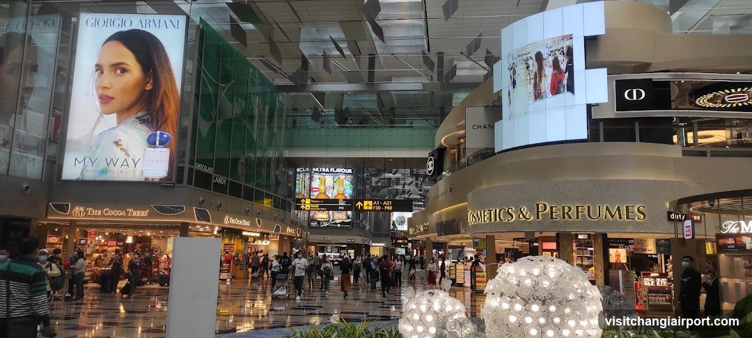 Airport Terminal Interior with Shopping and Advertising