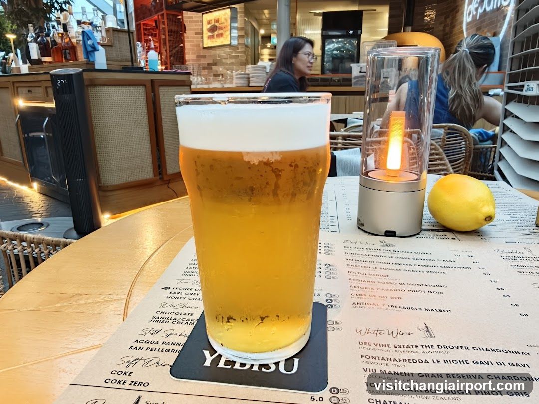 Beer and Lemon at a Bar Table