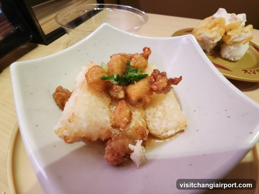 Fried Food Dish with Sauce and Garnish