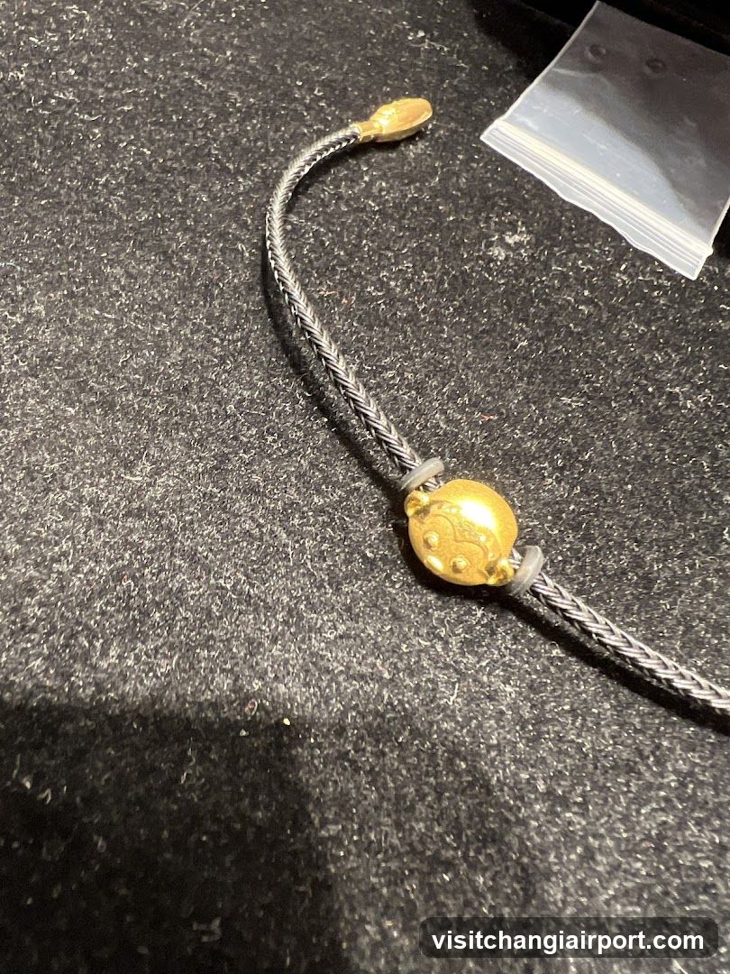 Gold Bracelet on Dark Surface