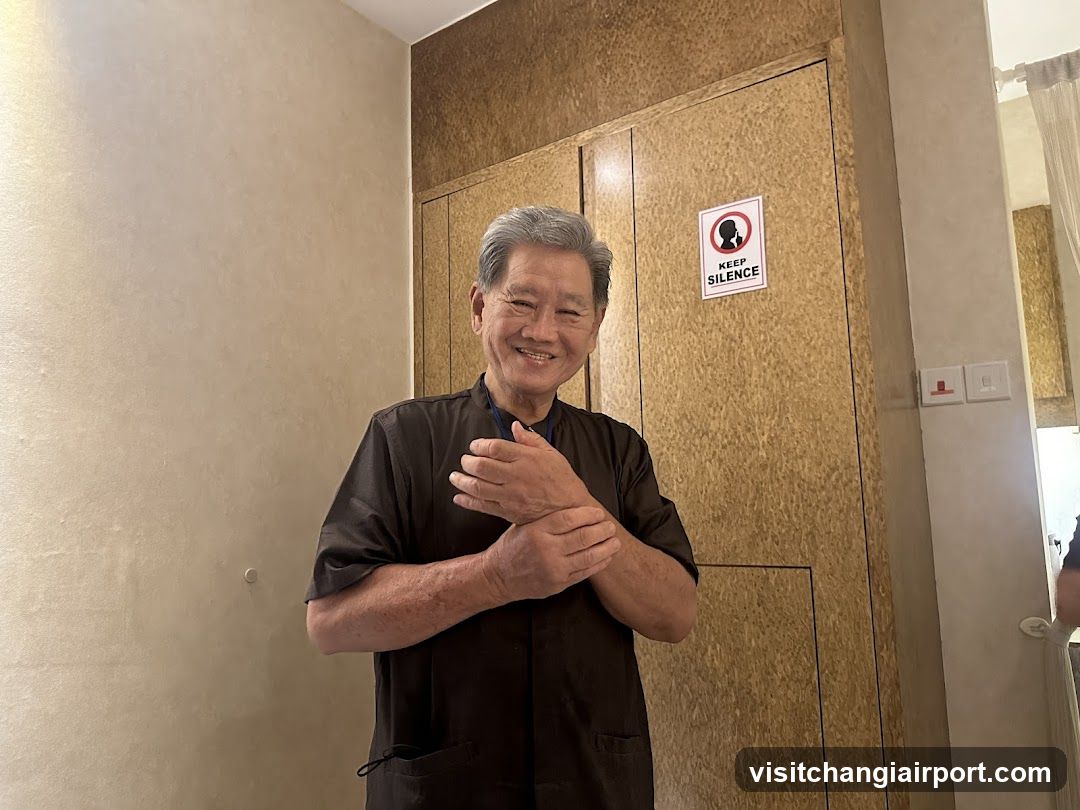 Smiling man in dark shirt indoors