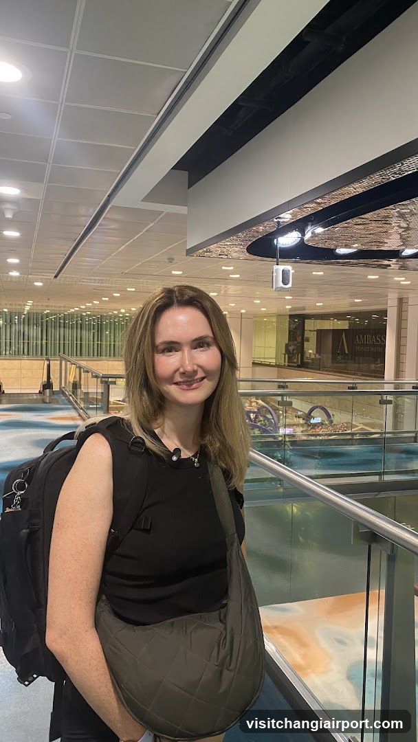 Woman with Backpack in Airport Terminal