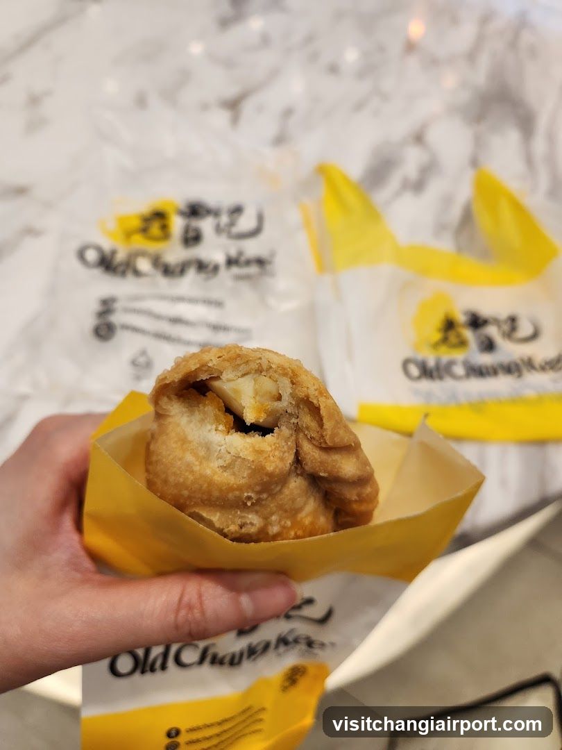 Old Chang Kee pastry in hand