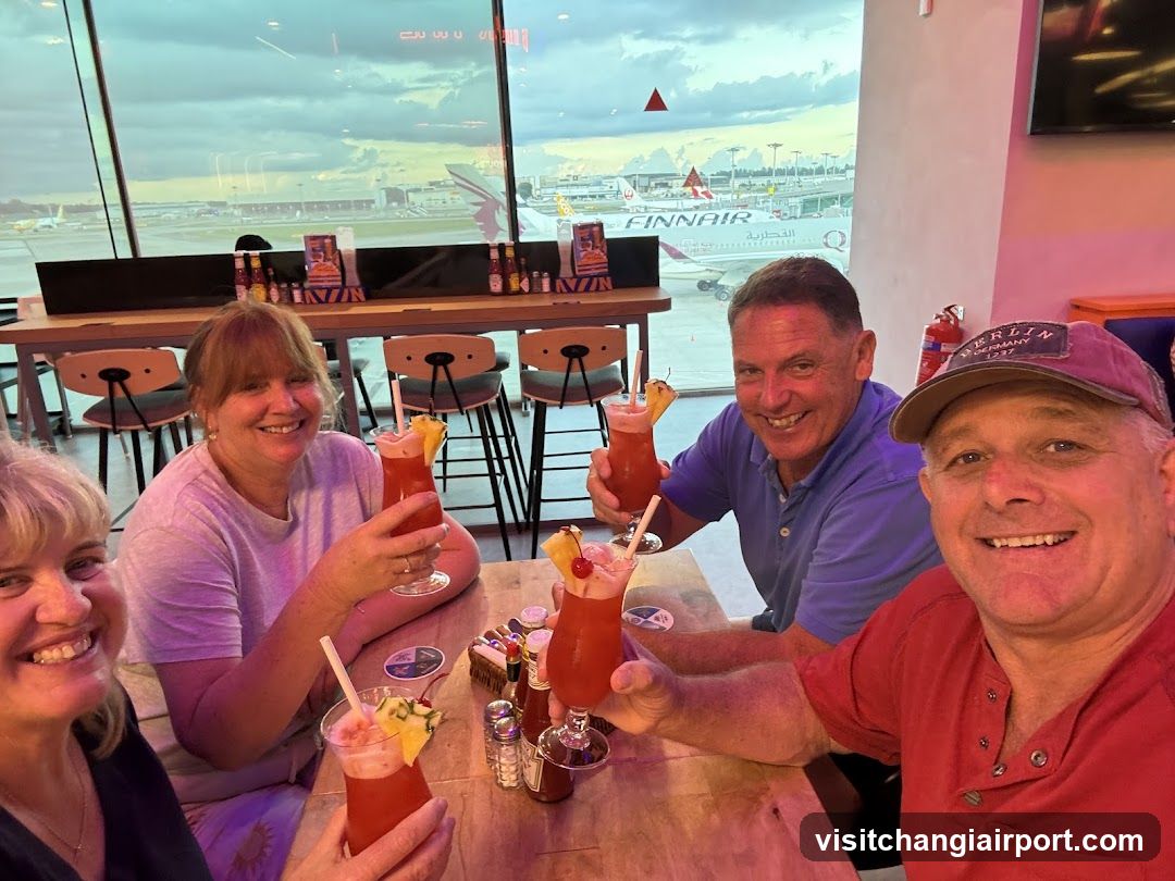 Group enjoying drinks at airport lounge