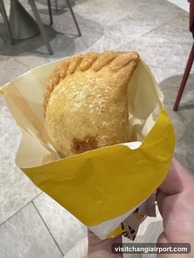 Handheld Pastry in Paper Wrapper