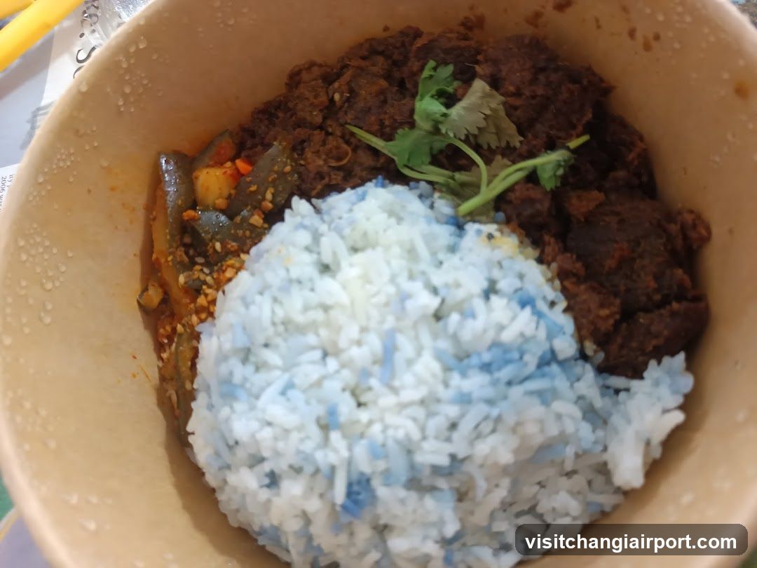 Bowl of Blue Rice with Meat and Curry