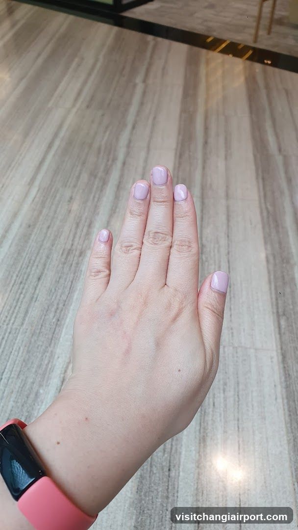 Hand with Pink Nail Polish