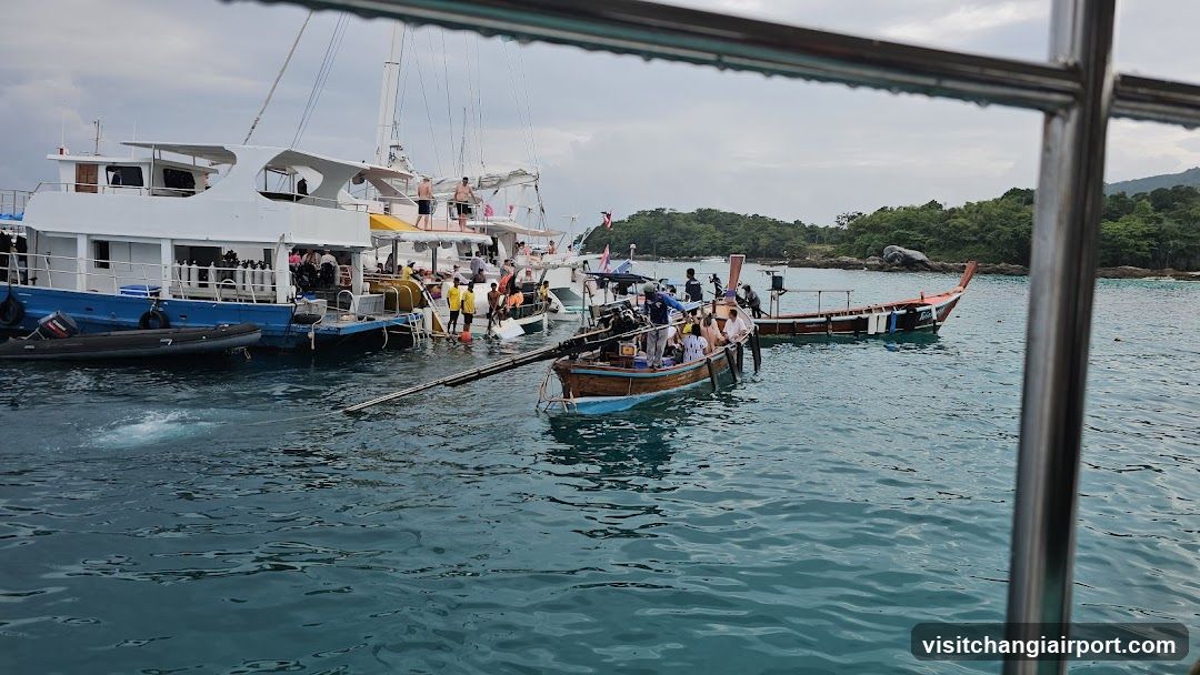 Boats in a harbor with passengers boarding