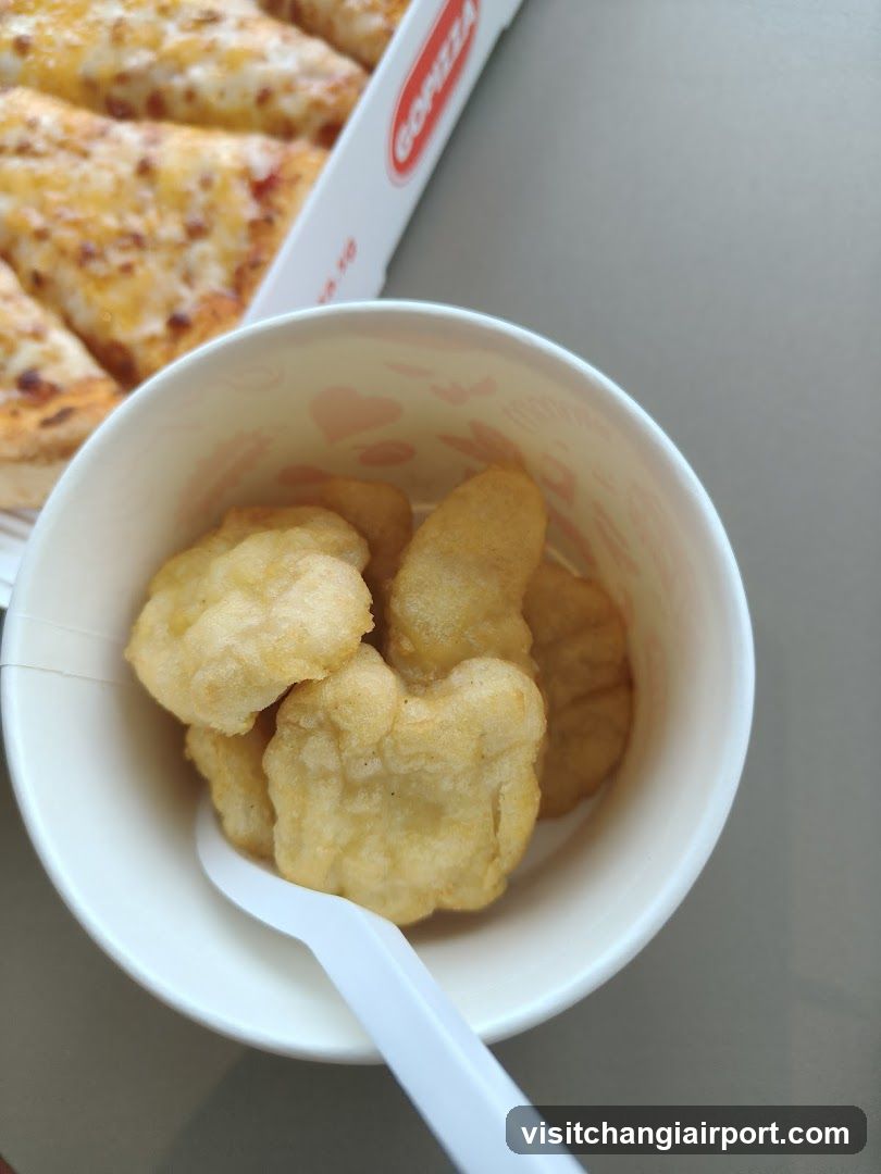 Food items in a bowl and pizza box