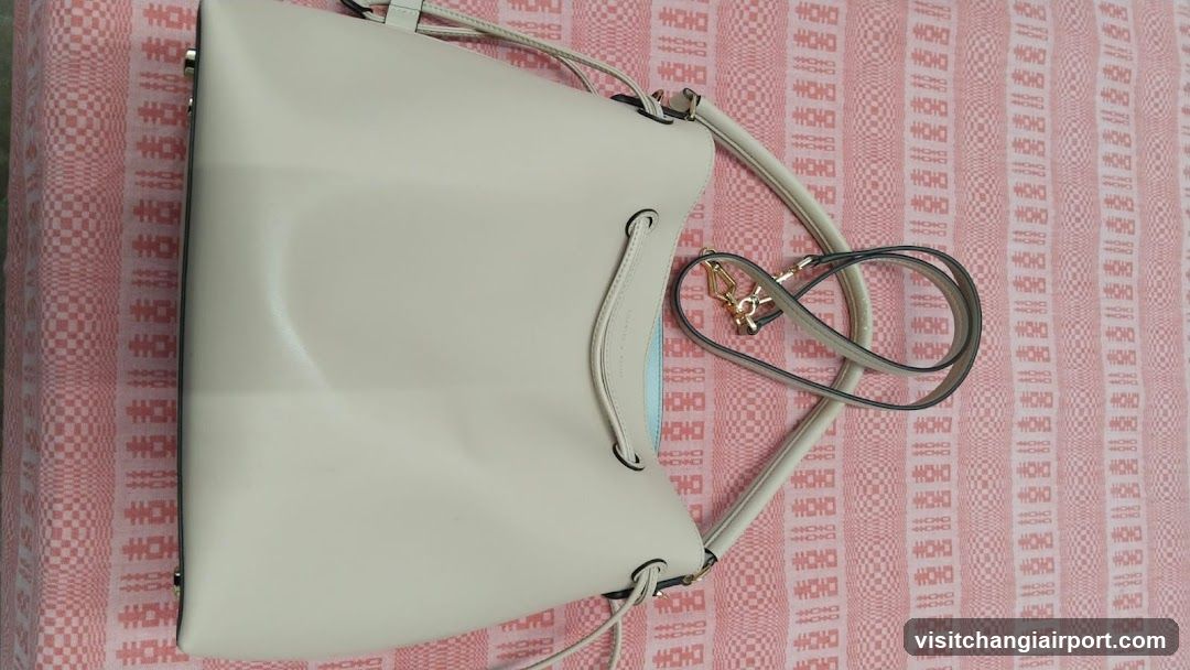 White Handbag on Patterned Fabric