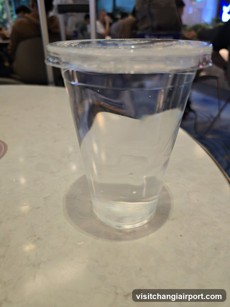 Clear plastic cup with water on a table