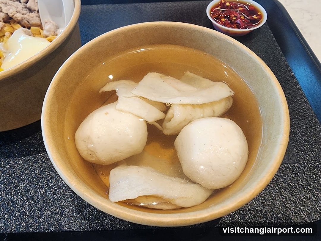 Bowl of Soup with Dumplings and Sides