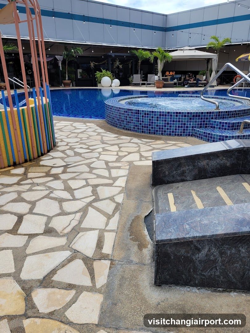 Pool Area with Hot Tub and Patio Seating