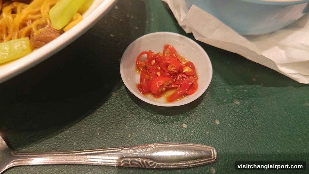 Dining Table with Chili Sauce and Noodles